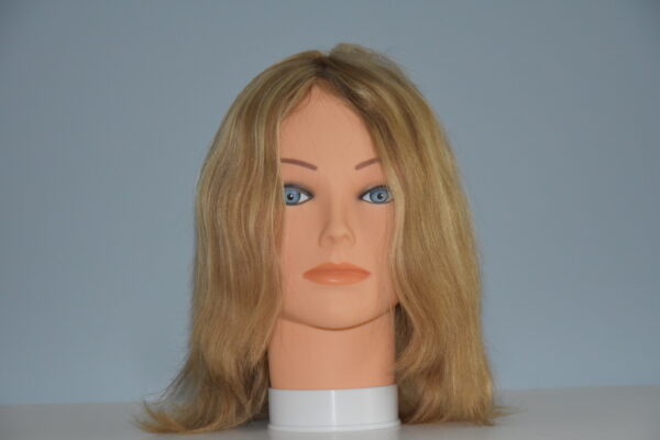 medium length blonde human hair wig on mannequin head