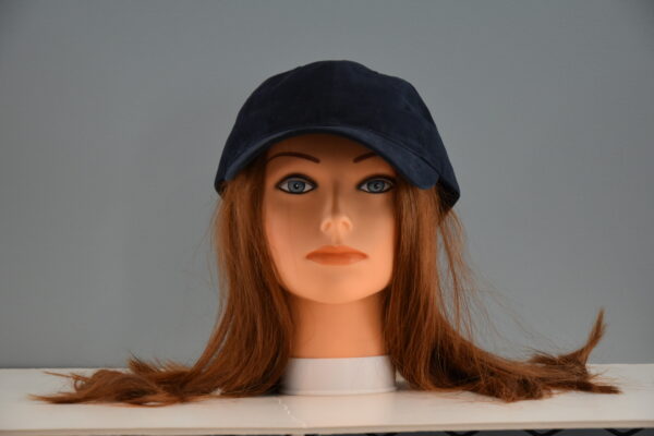 long red chemo diva wig on mannequin head with hat