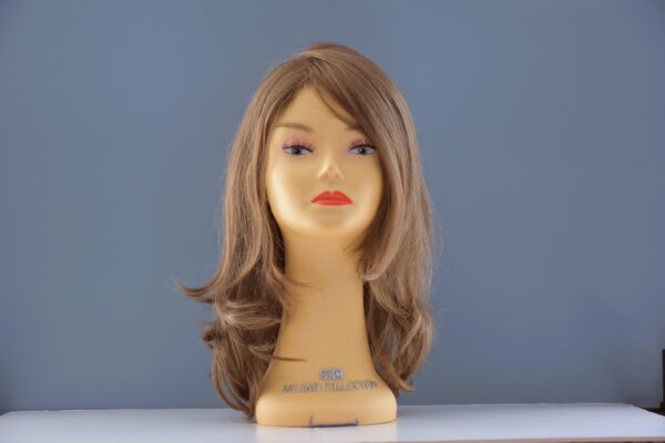 long blonde synthetic wig on mannequin head