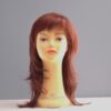 Long red synthetic wig on mannequin head