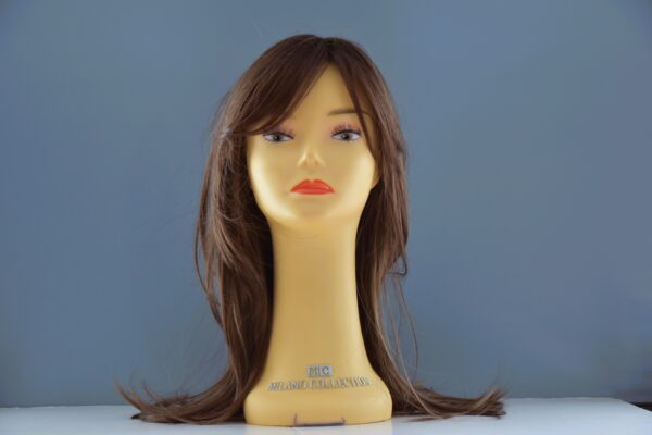 long brown synthetic wig on mannequin head