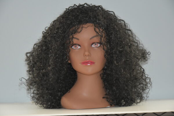 Long black curly synthetic wig on mannequin head