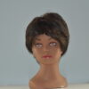short black synthetic wig on mannequin head
