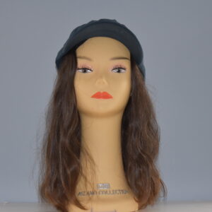 long brown human hair wig on mannequin head with hat