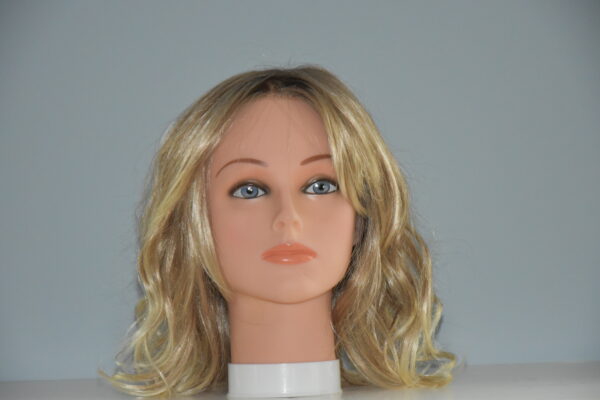 medium length blonde synthetic wig on mannequin head