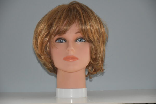 short red synthetic wig on manneqin head